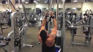 A gym goer doing a Lat pull-down.